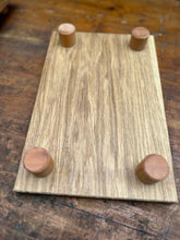 Small presentation board made from one piece of oak. Small beech feet. Oiled. MINIBOARD