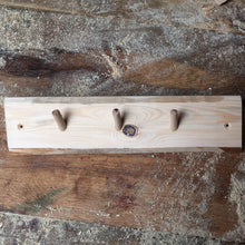 Coat rack made from reclaimed softwood and 3 hardwood dowels. Untreated. 7656 2775