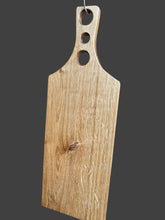 One piece oak chopping board with a 3 holed handle. Oiled. 4548 5655