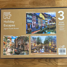 Corner Piece 1x1000 and 2x500 piece jigsaw puzzle - "Holiday Escapes" - checked