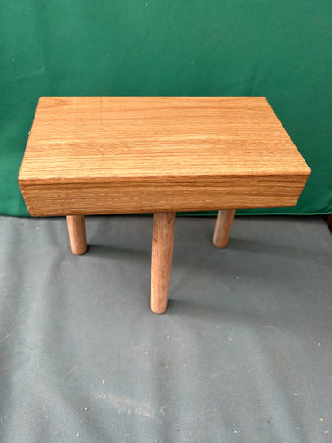 Small 3 legged low table made from oak. Oiled.