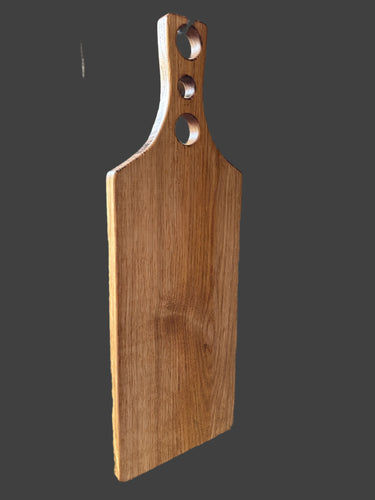 One piece oak chopping board with a 3 holed handle. Oiled. 4548 5655