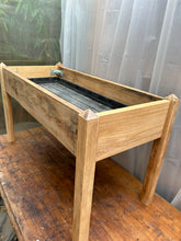 Patio plant stand made with reclaimed oak and complete with a grow bag tray. Oiled. 3591 9957 or 9958