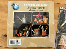 Puzzle World 500 piece Jigsaw Puzzle - "The Potting Shed Retreat". Checked