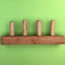 Coat rack made from oak and rough cut oak pegs. Oiled. 9352 2775